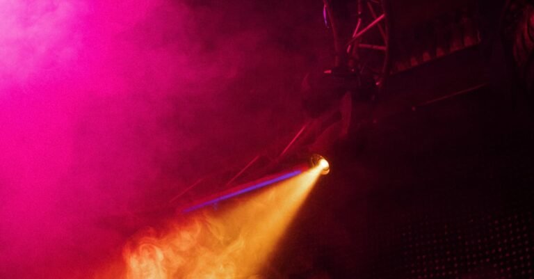 Colorful nightclub scene with vibrant lighting and smoke creating an energetic party vibe.